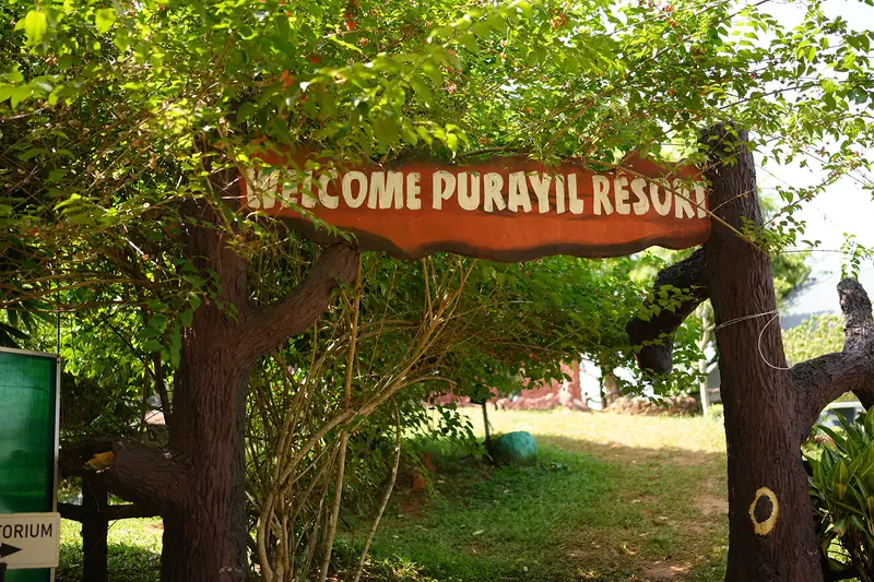 Welcome Purayil Resort sign arch at the entrance